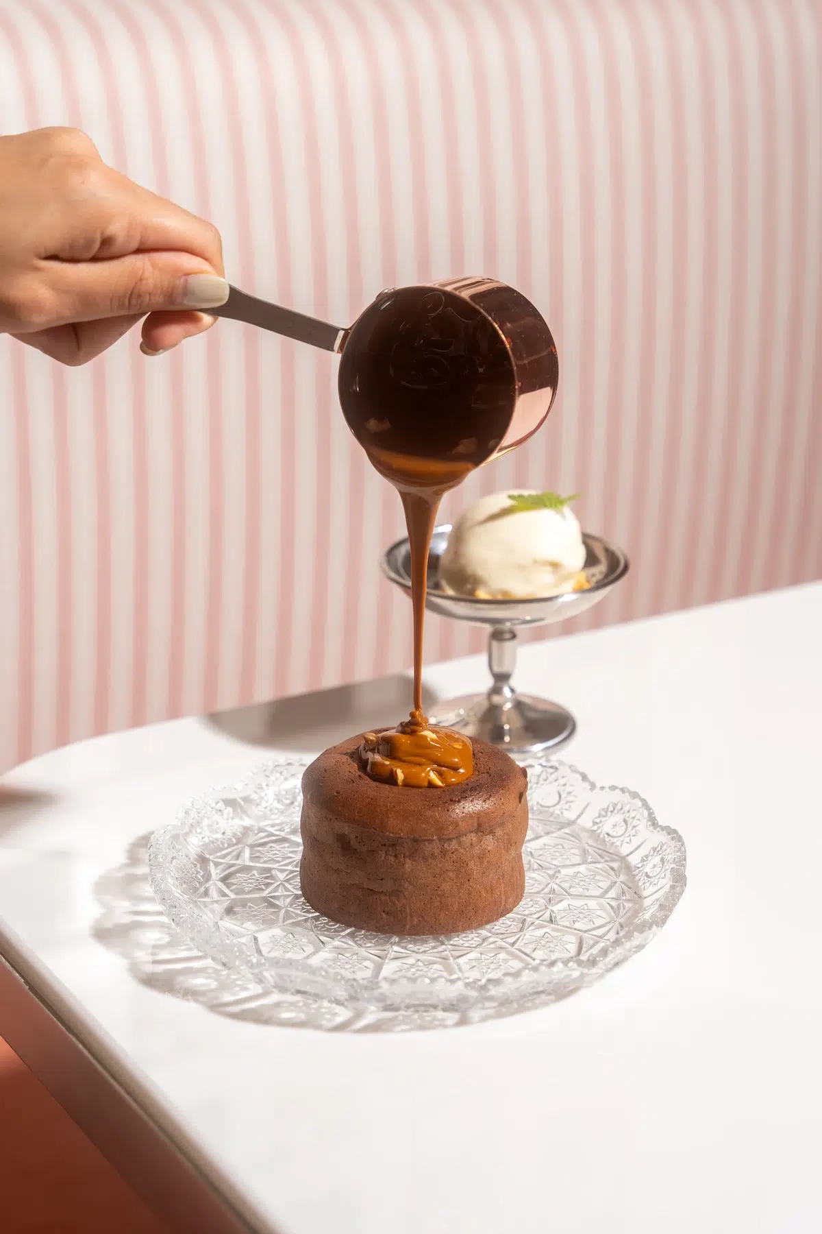 This dessert is the tasty Chocolate Lava Cake, served with vanilla ice cream and caramel sauce, from Mami Rose Restaurant located in EmSphere mall near Phrom Pong in Bangkok.